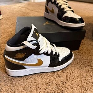 Nike Kids' Black, White, and Gold Sneakers